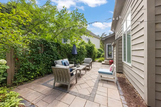 a view of backyard with sitting area