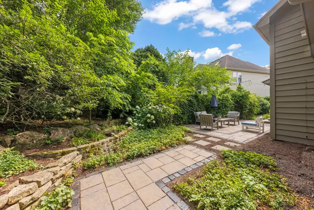 a view of a backyard with sitting area
