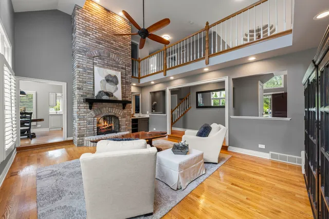 a living room with fireplace furniture and a fireplace
