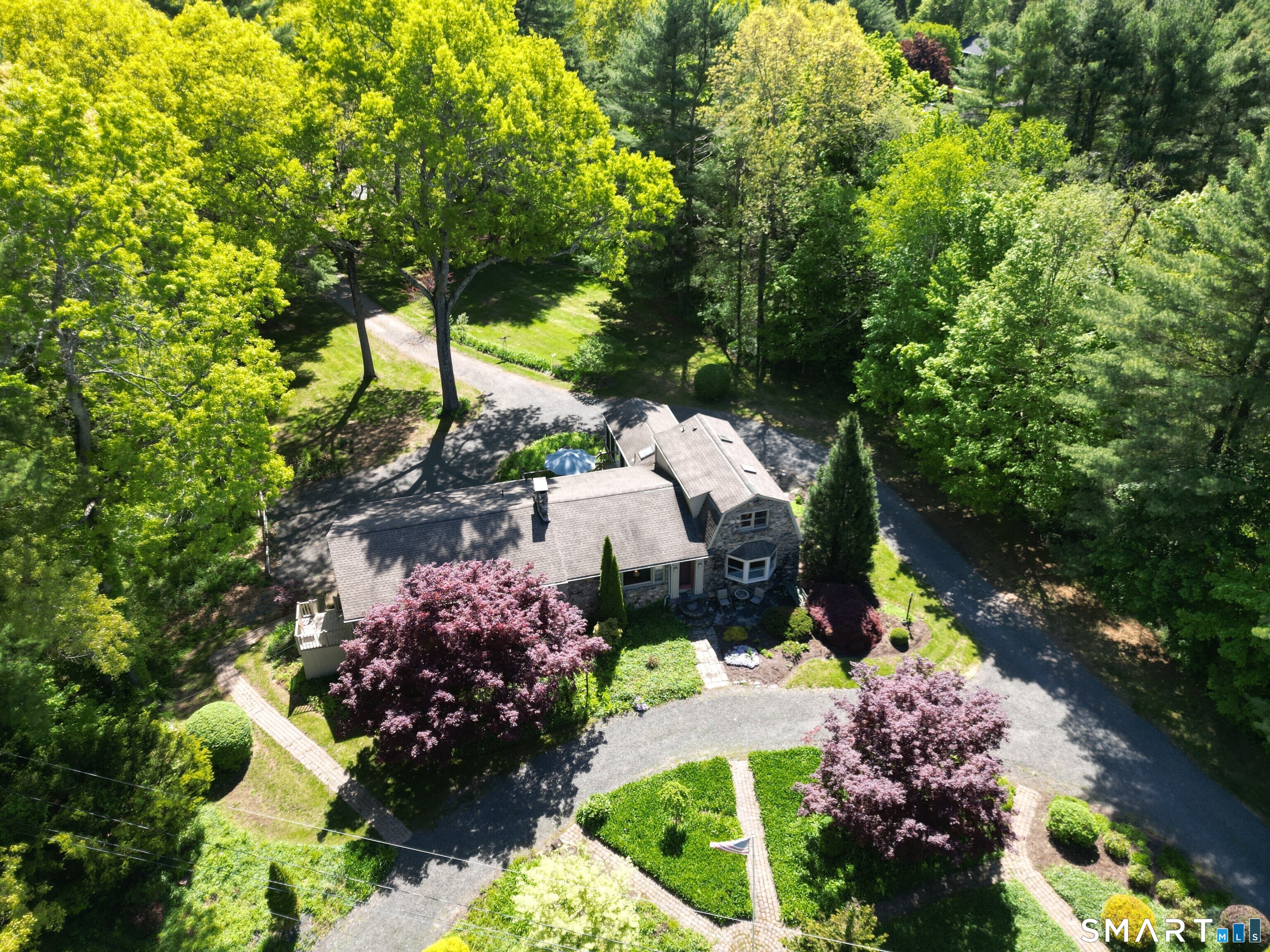 174 Canton Road Granby, CT 06035 - Photo 2 of 35 a view of a garden with flowers