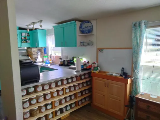 a kitchen with a sink and cabinets