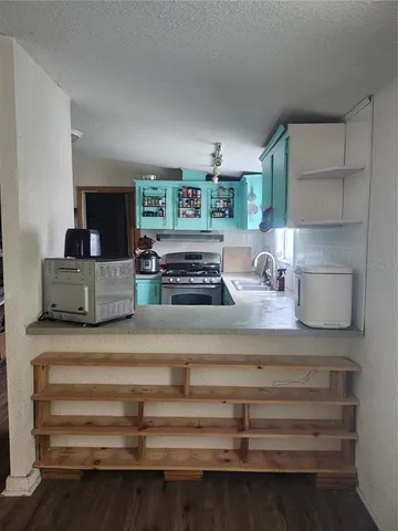 a view of living room with furniture and flat screen tv
