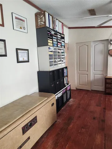 a view of kitchen and wooden floor