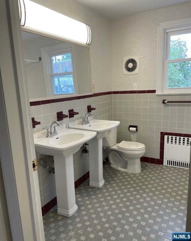 602 Studio Road Ridgefield, NJ 07657 - Photo 6 of 10 a bathroom with a sink toilet and mirror