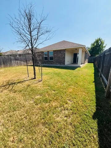 a house view with swimming pool in front of it