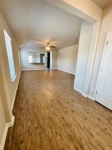 a view of livingroom with hardwood floor and front door