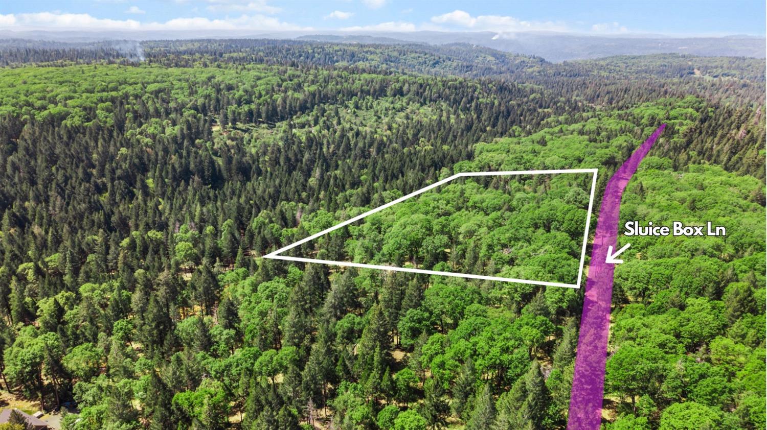 0 Sluice Box Lane Foresthill, CA 95631 - Photo 2 of 16 a view of a lush green field with a small yard