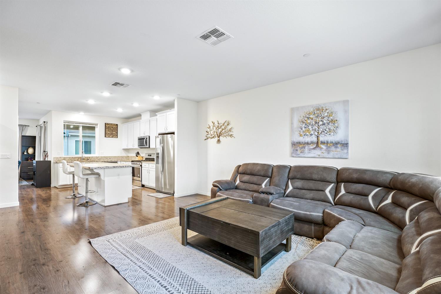 4174 Sally Ride Way Sacramento, CA 95834 - Photo 12 of 38 a living room with furniture and view of kitchen