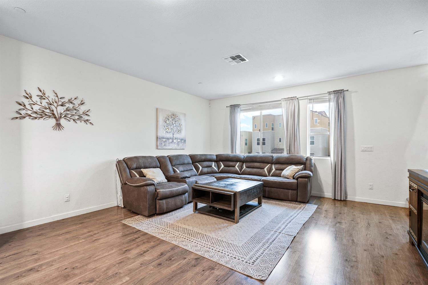 4174 Sally Ride Way Sacramento, CA 95834 - Photo 13 of 38 a living room with furniture and wooden floor