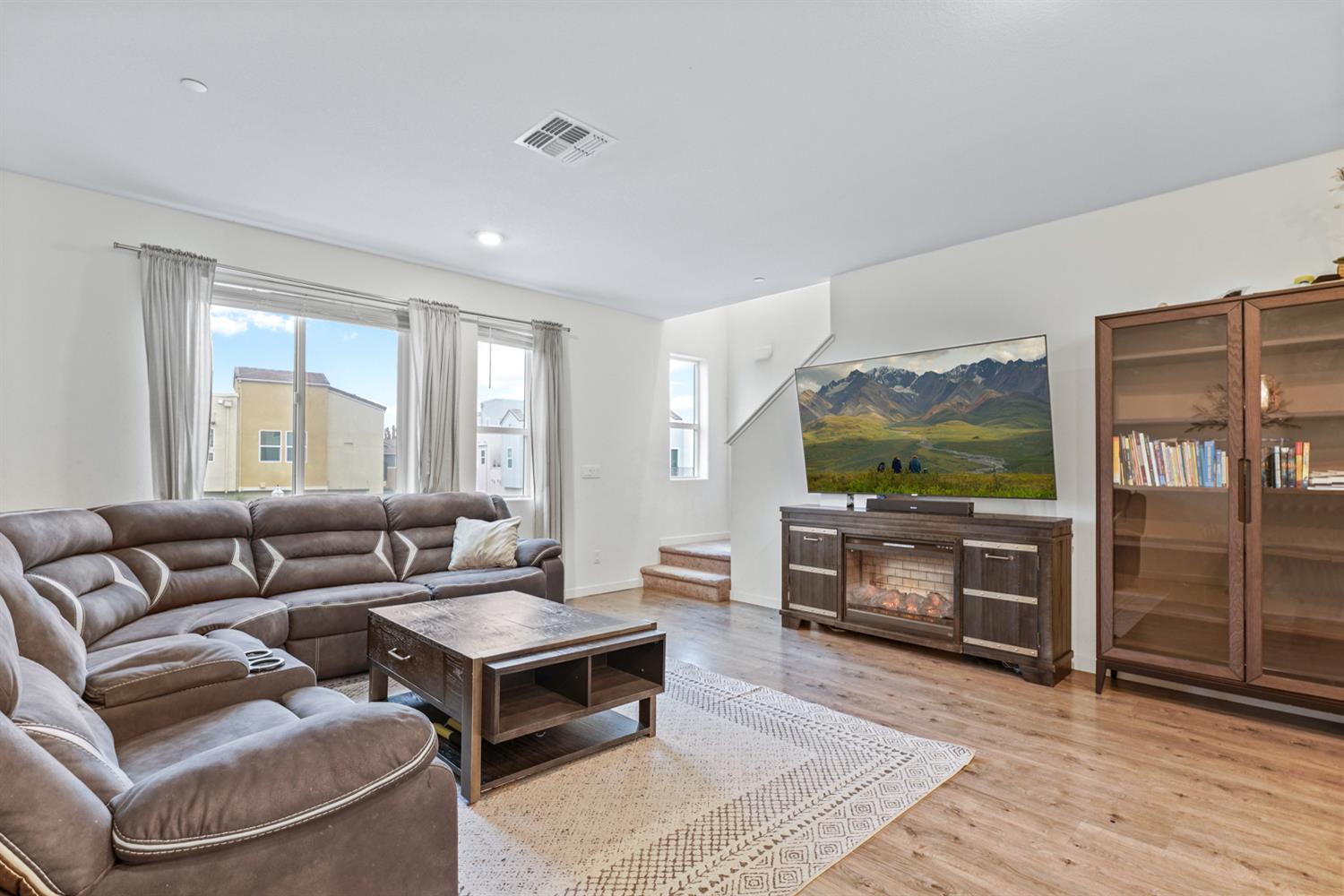 4174 Sally Ride Way Sacramento, CA 95834 - Photo 14 of 38 a living room with furniture and a flat screen tv