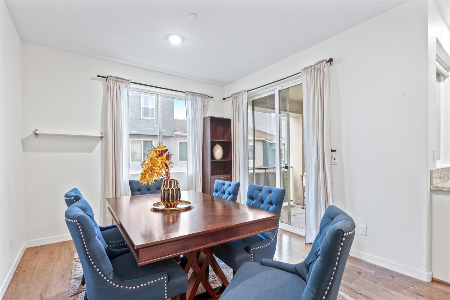 4174 Sally Ride Way Sacramento, CA 95834 - Photo 20 of 38 a view of a dining room with furniture window and wooden floor