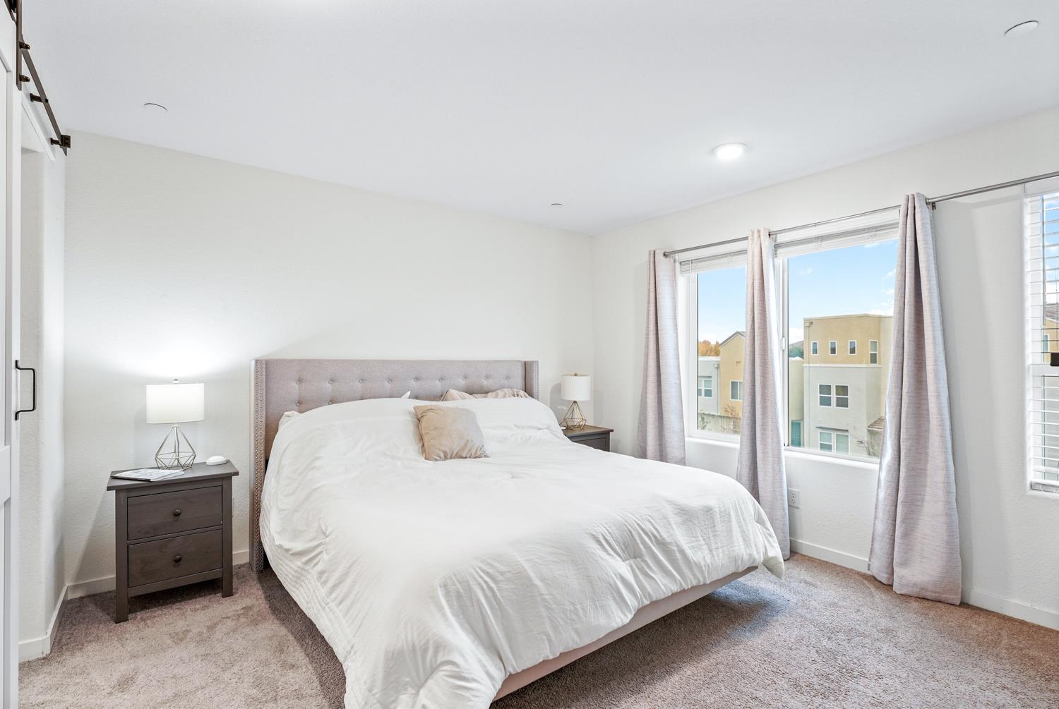 4174 Sally Ride Way Sacramento, CA 95834 - Photo 27 of 38 a bedroom with a bed and large closet