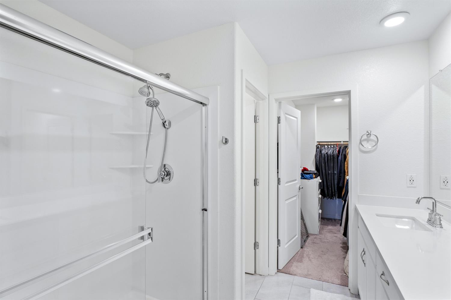 4174 Sally Ride Way Sacramento, CA 95834 - Photo 31 of 38 a bathroom with a tub sink and mirror