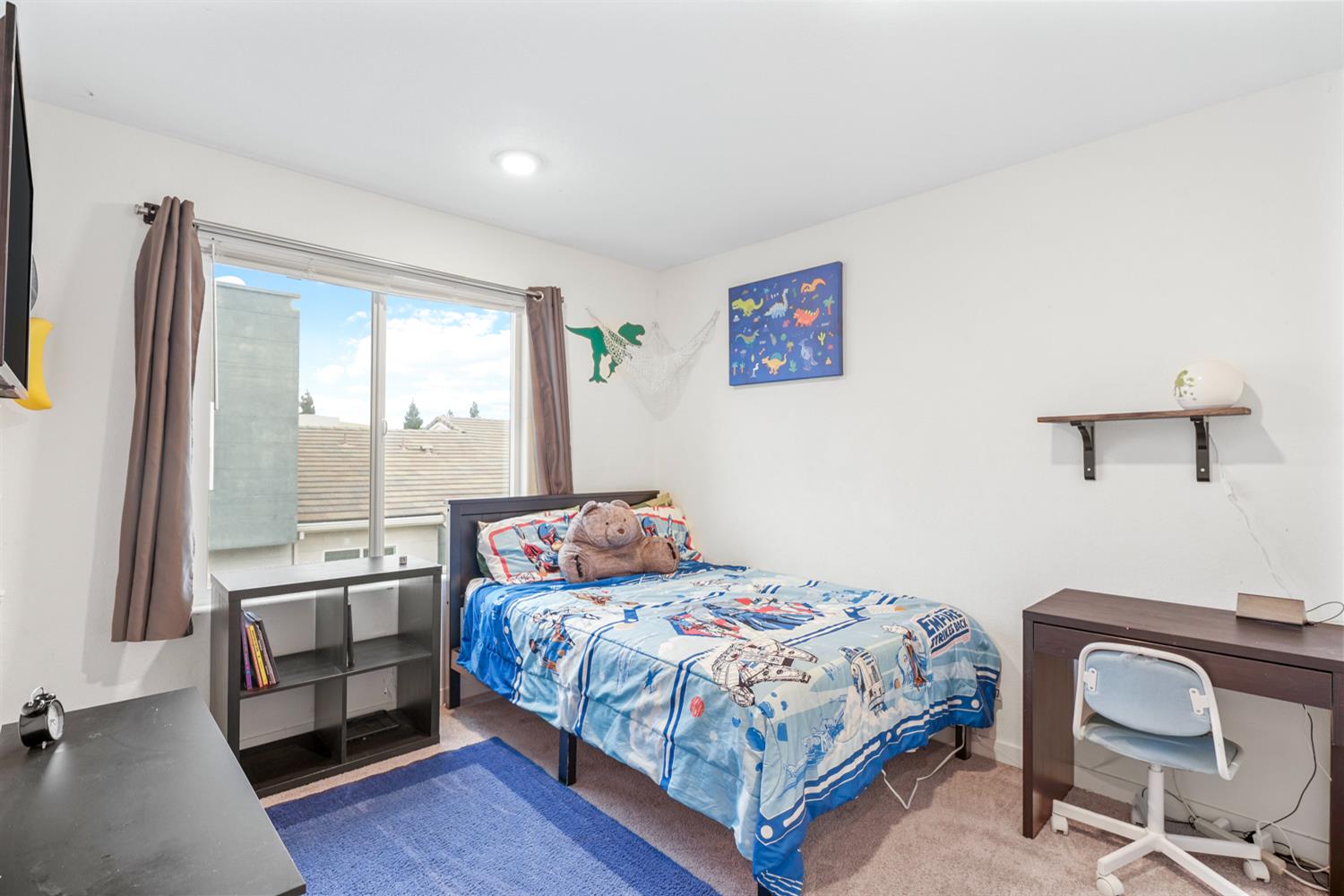 4174 Sally Ride Way Sacramento, CA 95834 - Photo 33 of 38 a bedroom with a bed and a window