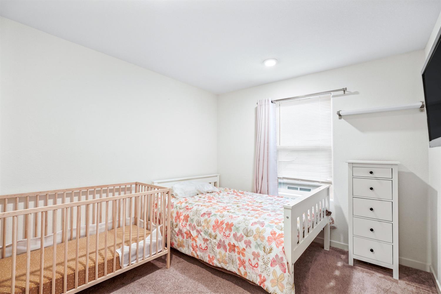 4174 Sally Ride Way Sacramento, CA 95834 - Photo 35 of 38 a bedroom with a bed and a window