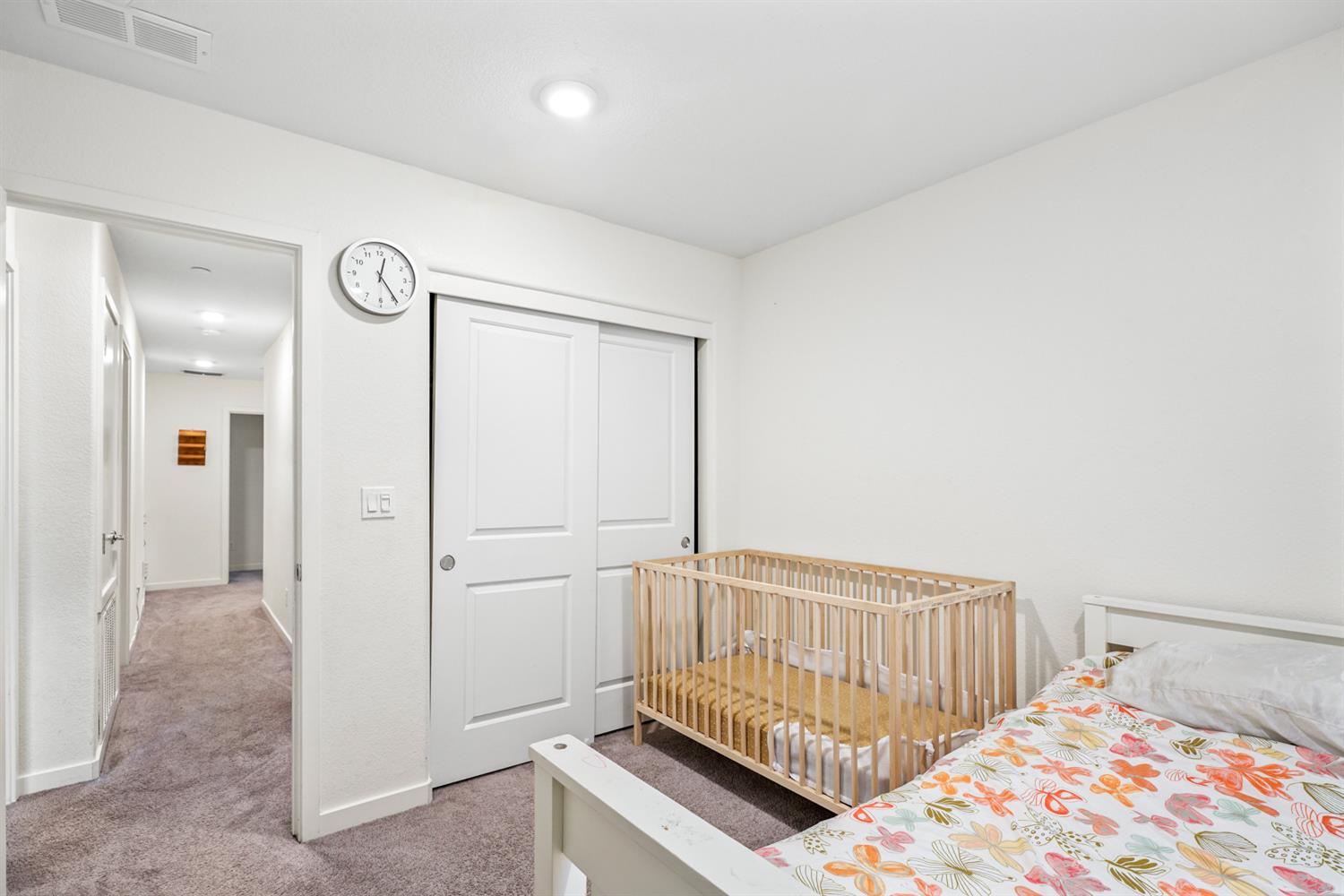 4174 Sally Ride Way Sacramento, CA 95834 - Photo 36 of 38 a bedroom with a bed and a lamp