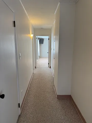 a view of hallway with closet