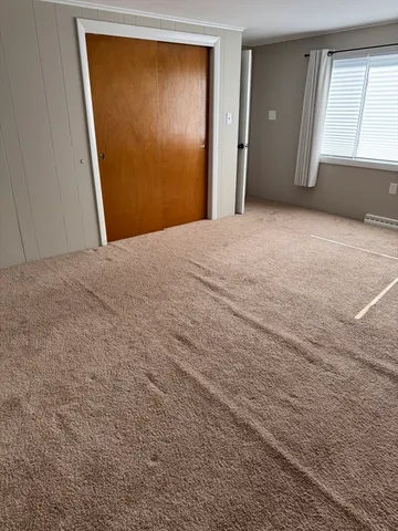 a view of a room with window and closet