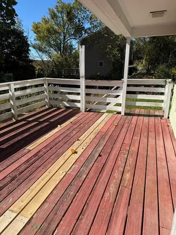 a view of outdoor space with deck and hardwood