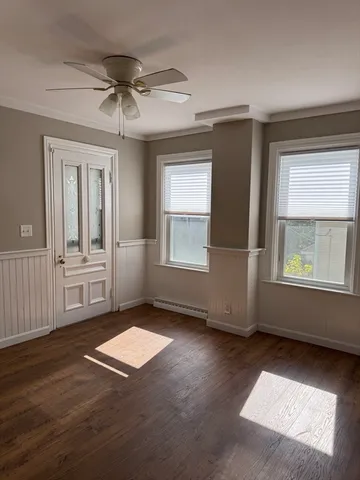 a view of livingroom with hardwood floor and a ceiling fan