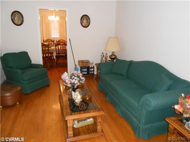 10315 Oakton Road Chesterfield, VA 23838 - Photo 5 of 8 a living room with furniture and a flat screen tv