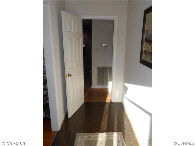 10315 Oakton Road Chesterfield, VA 23838 - Photo 6 of 8 a view of a hallway with wooden floor