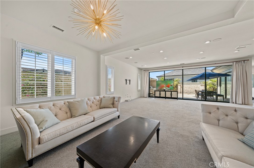 52 Eider Run Irvine, CA 92618 - Photo 25 of 46 a living room with furniture and a large window