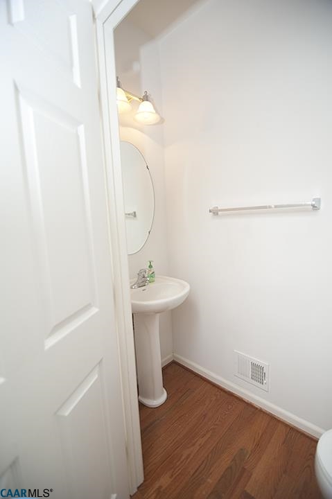 702 Rainier Road Charlottesville, VA 22903 - Photo 12 of 27 a bathroom with a sink a toilet and shower
