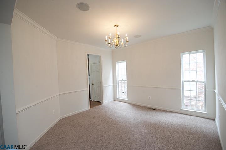 702 Rainier Road Charlottesville, VA 22903 - Photo 5 of 27 a view of a livingroom with a chandelier fan