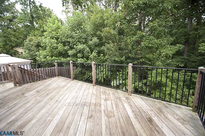 702 Rainier Road Charlottesville, VA 22903 - Photo 9 of 27 a view of balcony with wooden floor and fence