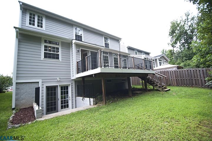 702 Rainier Road Charlottesville, VA 22903 - Photo 10 of 27 a view of a house with a yard and a wooden deck