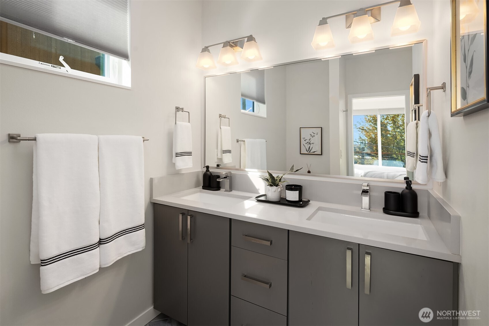 3300 Northeast 65th Street, Unit 211 Seattle, WA 98115 - Photo 10 of 15 a bathroom with a sink a faucet a mirror and a shower