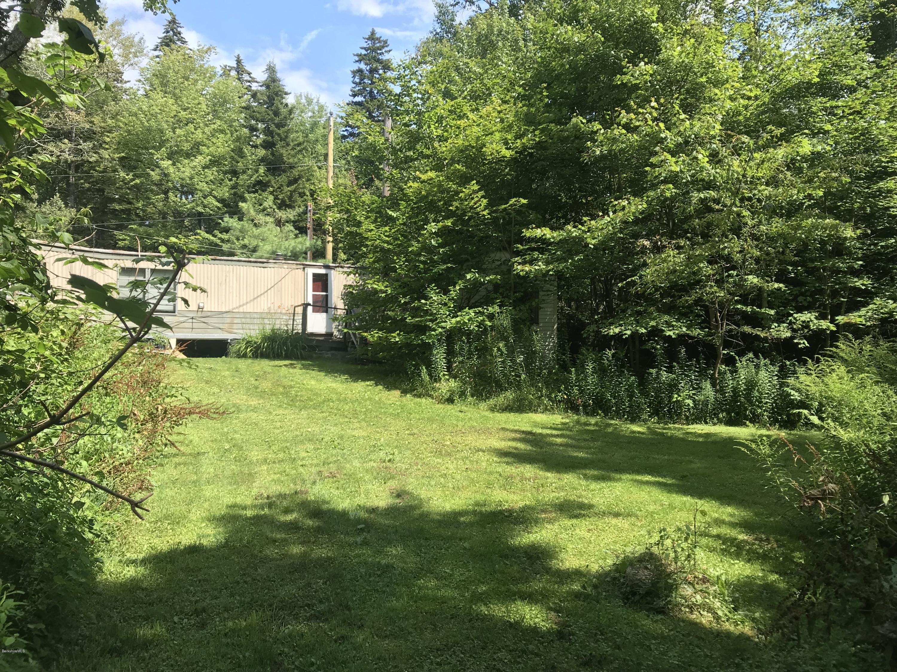 40 Humes Road Windsor, MA 01270 - Photo 2 of 10 a backyard of a house with lots of green space and fountain