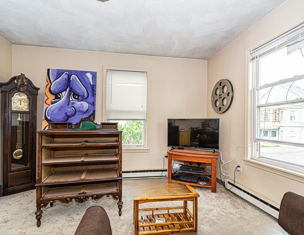 98 Margin Street Salem, MA 01970 - Photo 12 of 17 a room with furniture and window