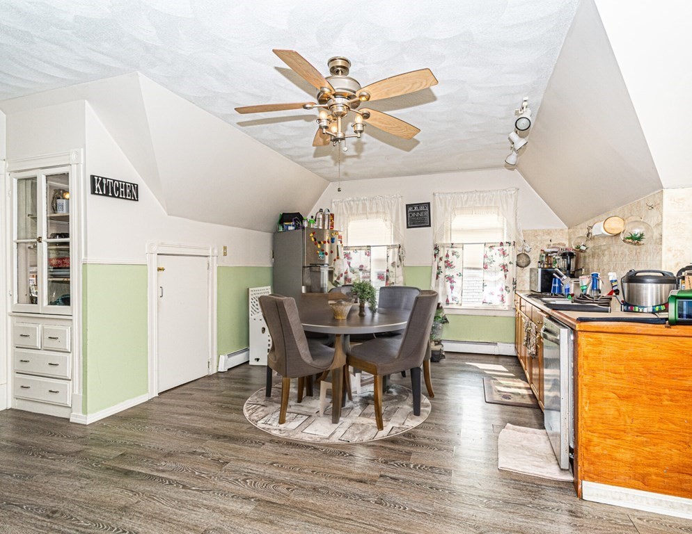 98 Margin Street Salem, MA 01970 - Photo 13 of 17 a view of a dining room with furniture window and wooden floor