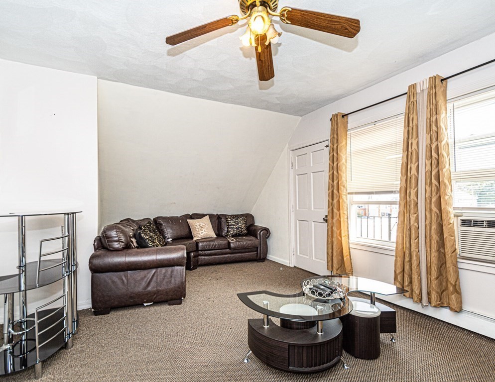 98 Margin Street Salem, MA 01970 - Photo 14 of 17 a living room with furniture and a window