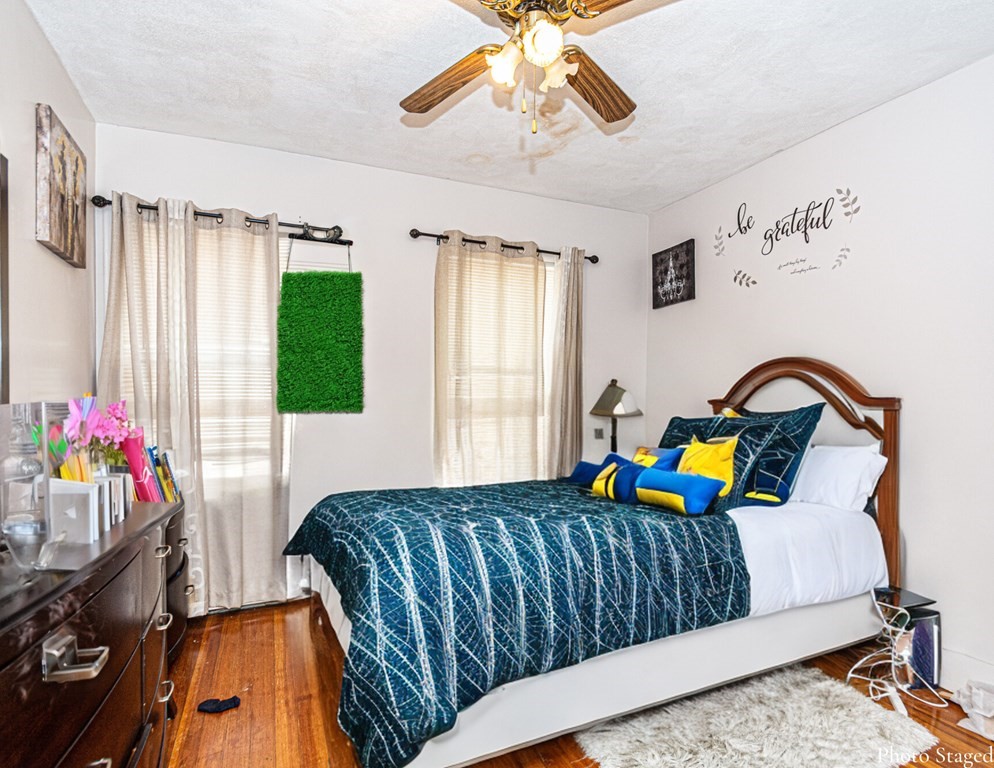 98 Margin Street Salem, MA 01970 - Photo 17 of 17 a bedroom with bed and a window
