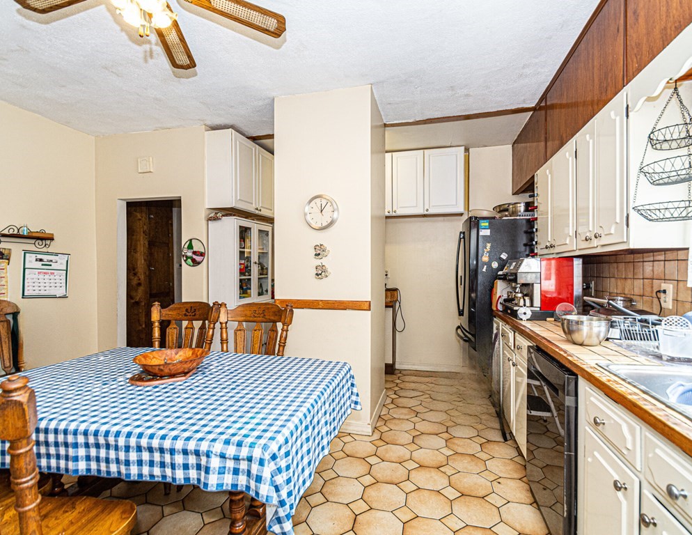 98 Margin Street Salem, MA 01970 - Photo 2 of 17 a kitchen with a sink appliances and cabinets