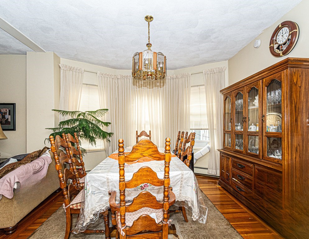 98 Margin Street Salem, MA 01970 - Photo 6 of 17 a bedroom with furniture and a window