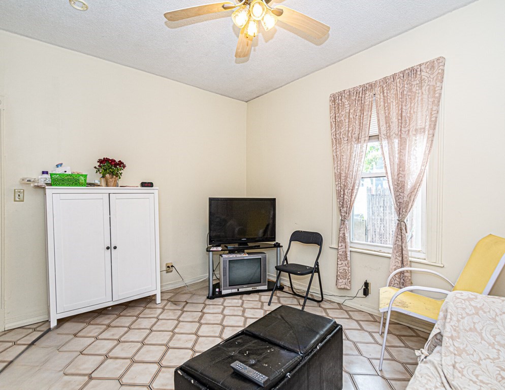 98 Margin Street Salem, MA 01970 - Photo 7 of 17 a view of a workspace with furniture and a window