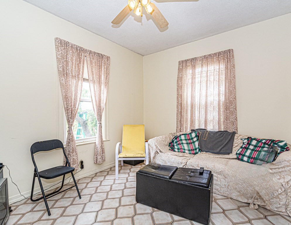 98 Margin Street Salem, MA 01970 - Photo 8 of 17 a living room with furniture and a window