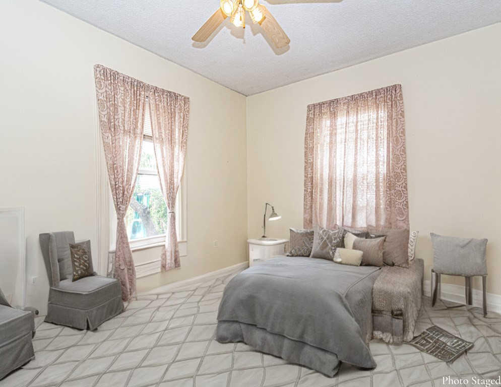 98 Margin Street Salem, MA 01970 - Photo 9 of 17 a bedroom with a bed and a couch