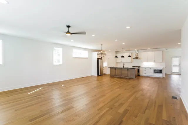 a view of a kitchen with a stove cabinets and wooden floor