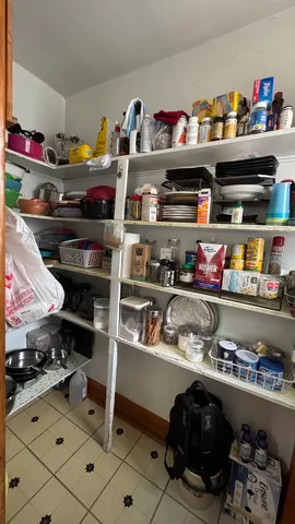 a kitchen with lots of bottles of alcohol