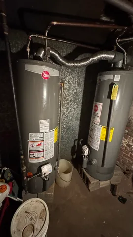 a bathroom with a toilet and a mirror