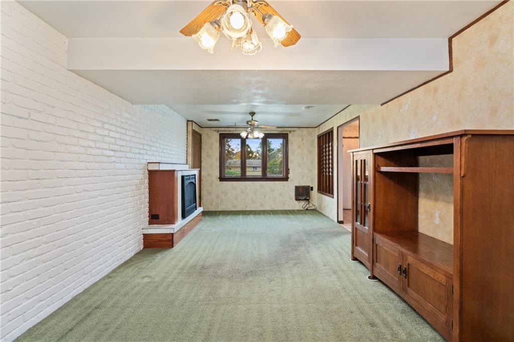 735 Harrison City Road Trafford, PA 15085 - Photo 25 of 36 Game Room has an electric fireplace (on the left).