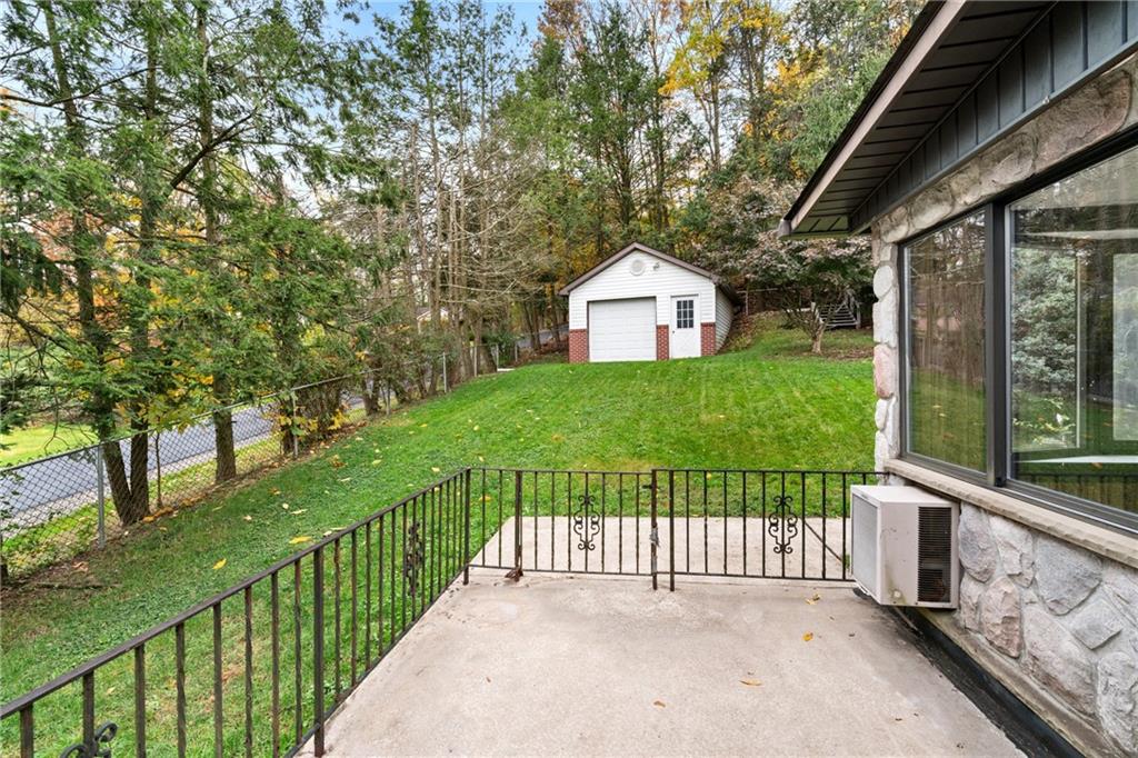 735 Harrison City Road Trafford, PA 15085 - Photo 4 of 36 Concrete patio is adjacent to the sun room.