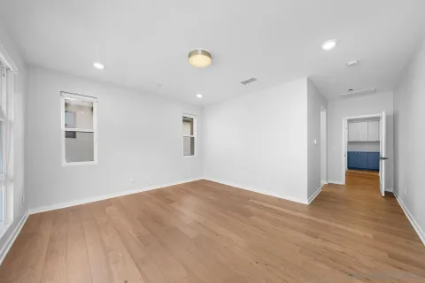 a room with a window and a ceiling fan