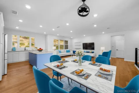 a large kitchen with stainless steel appliances granite countertop a large center island and a sink
