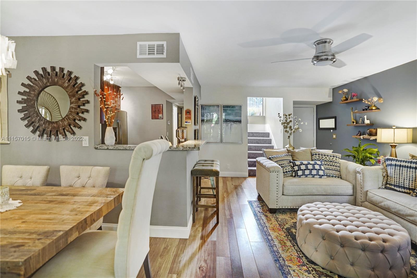 1089 Northwest 13th Street, Unit 6 Boca Raton, FL 33486 - Photo 8 of 32 a living room with furniture and a rug